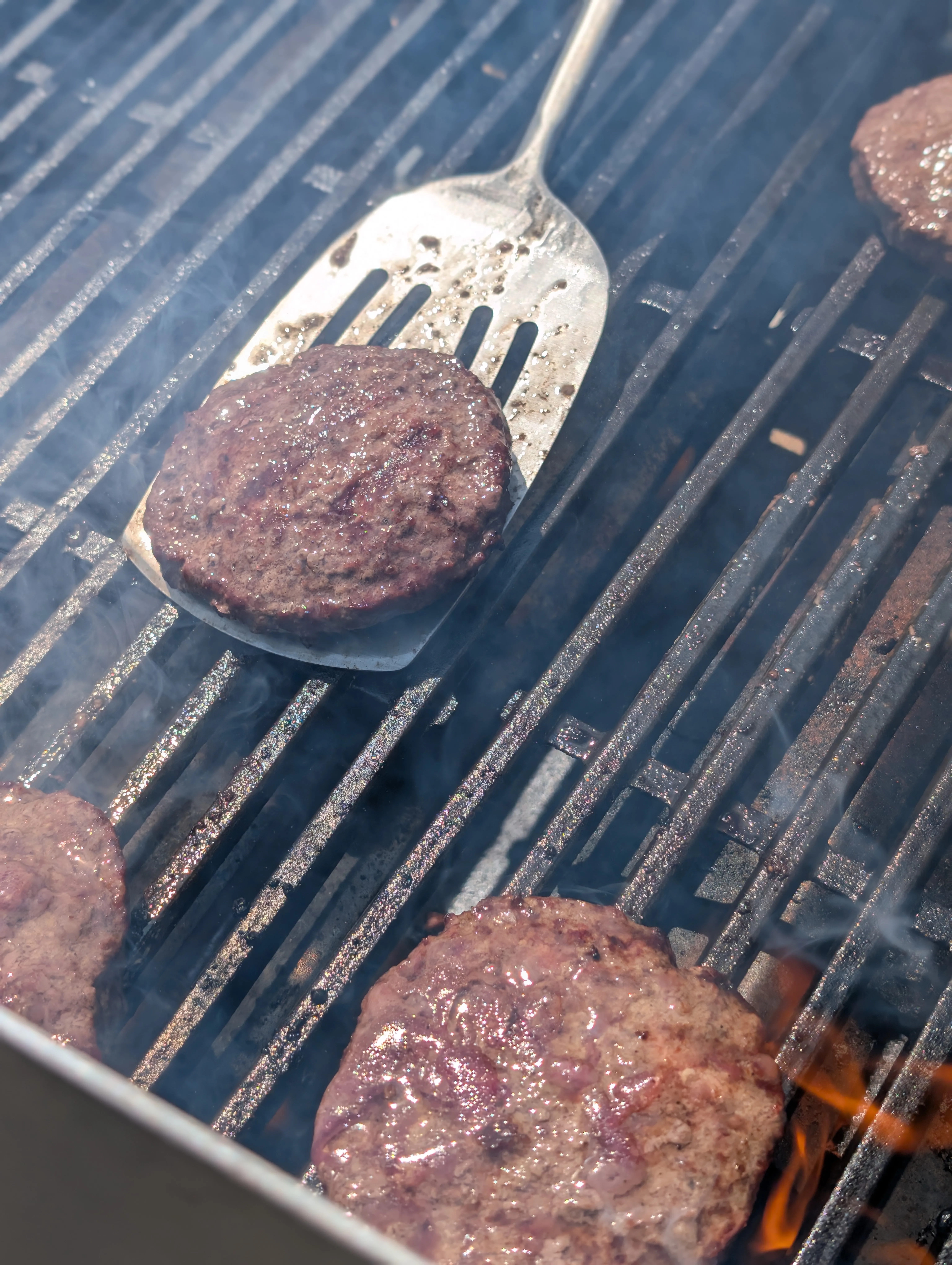 Food on the grill in the Caddy Snack's kitchen.